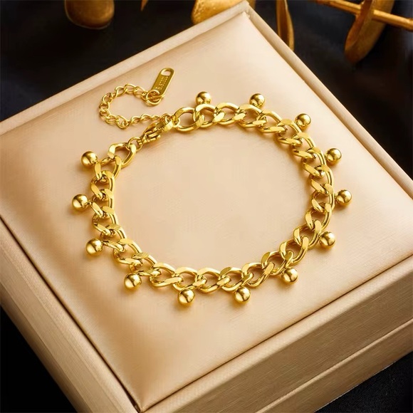 Jewelry - Elegant Gold Bracelet with Charm Accents